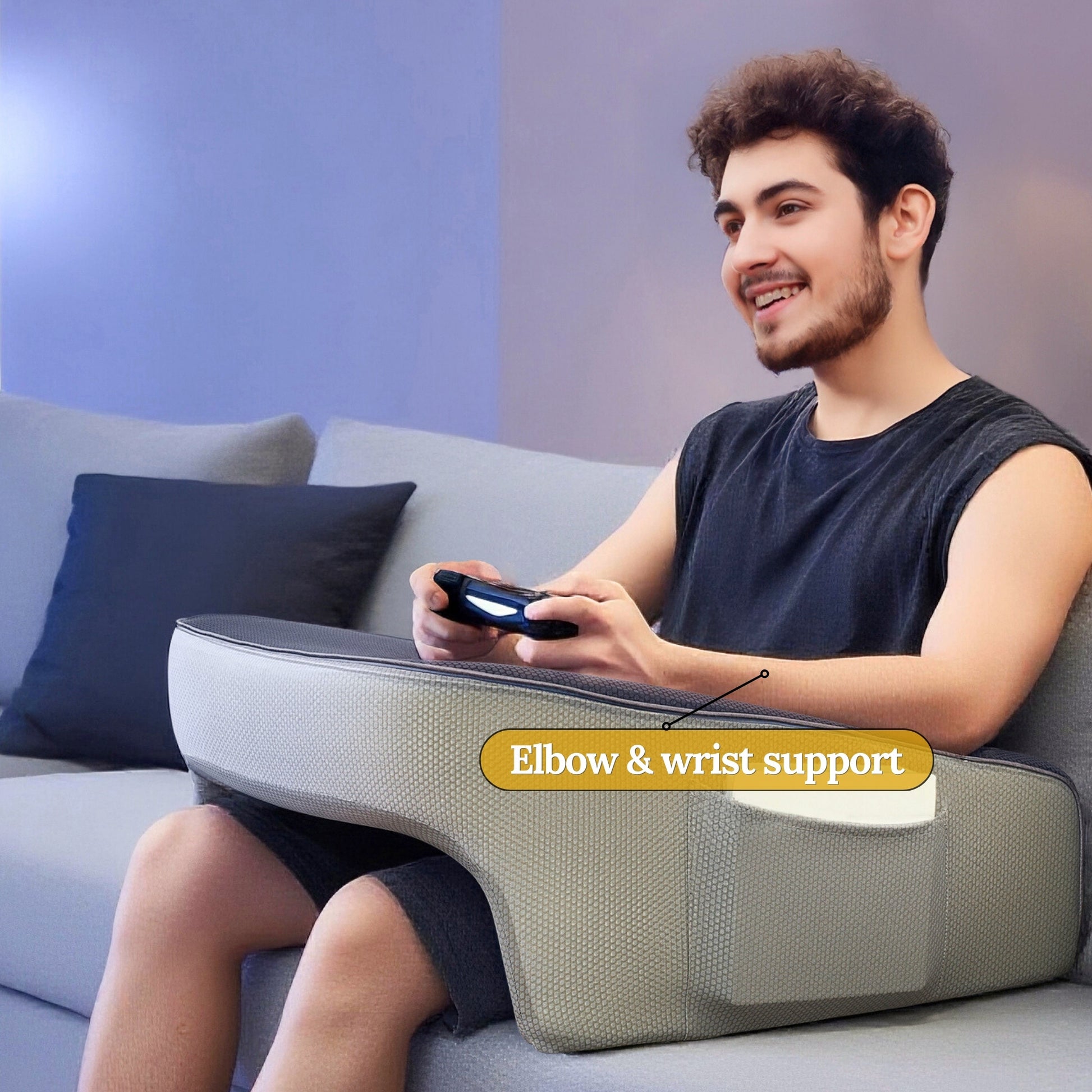 Gamer using a lap desk pillow with elbow and wrist support whilst gaming