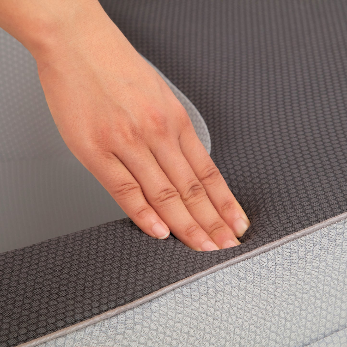 Close-up of memory foam lap desk pillow showing firm support and fabric texture